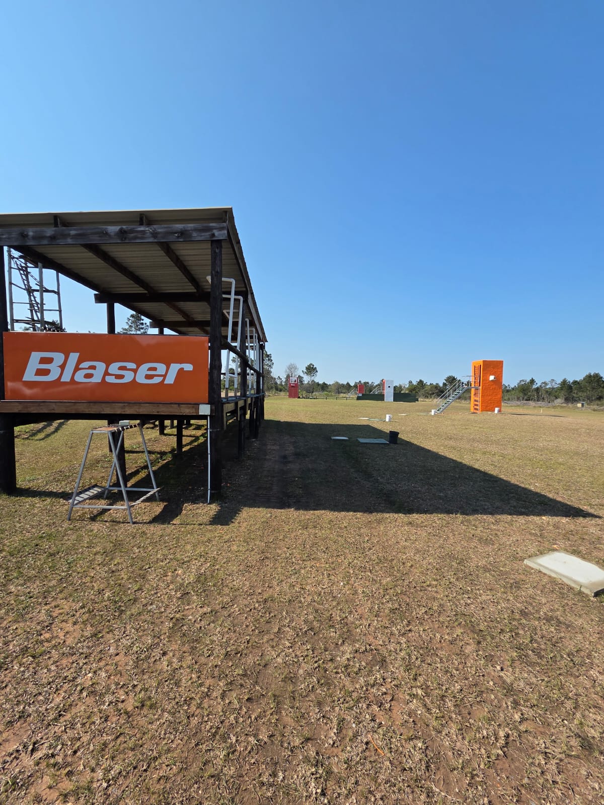 The covered Blaser shooting stand looking down the range towards the target towers