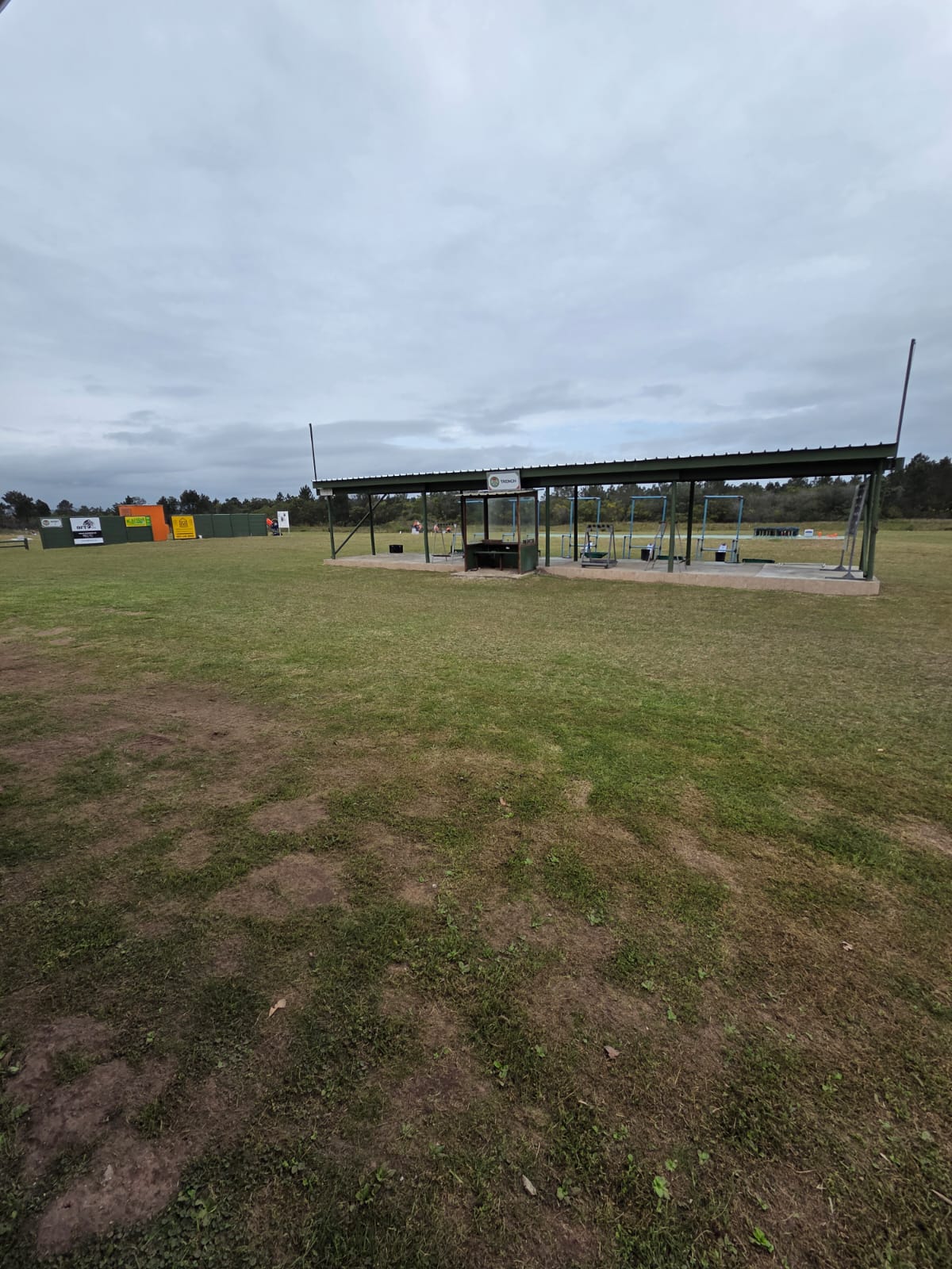 The long covered trench shooting bay at PECTC with the open range stretching away behind it