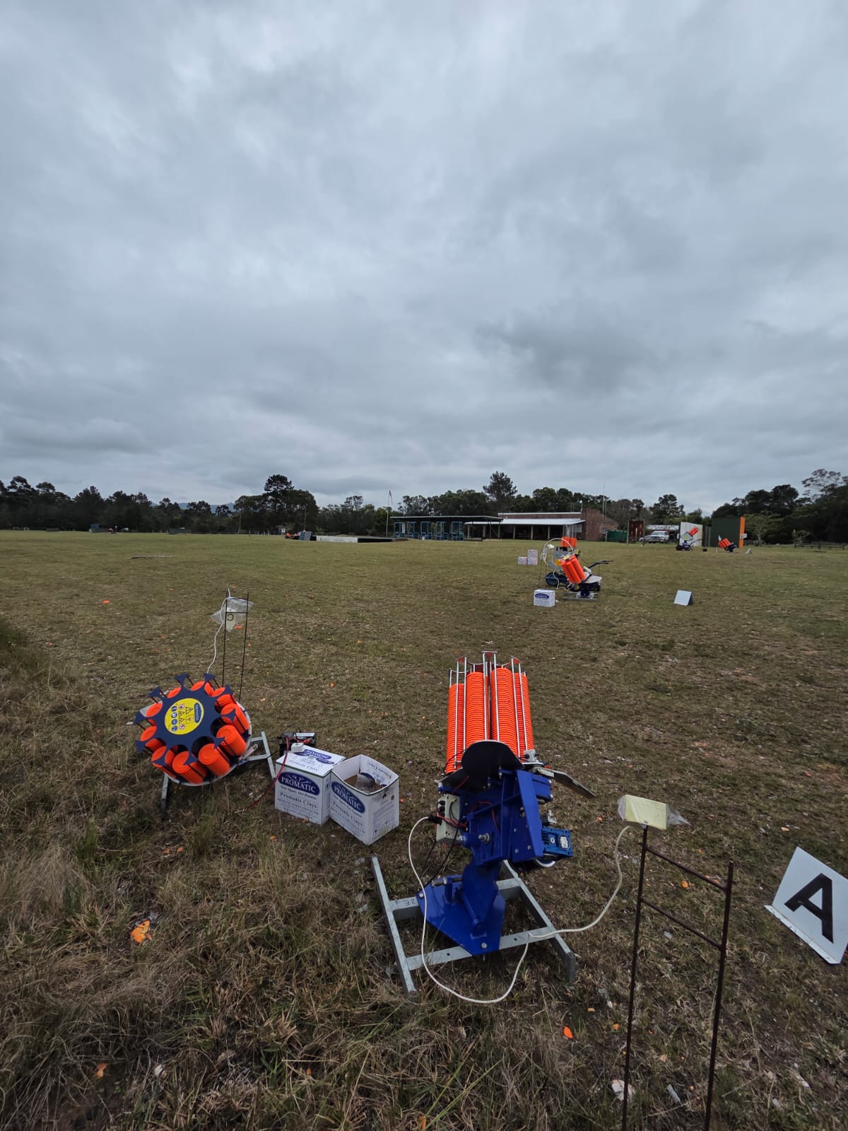 Clay target machines loaded with orange clays standing ready on the PECTC range